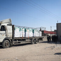 A truck carrying humanitarian aid arrives for processing at the Kerem Shalom border crossing with Gaza on April 15, 2024. (AFP)