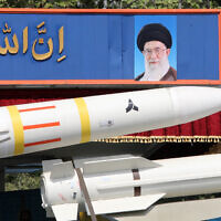 An Iranian military truck carries parts of a Sayad 4-B missile past a portrait of supreme leader Ayatollah Ali Khamenei during a military parade as part of a ceremony marking the country's annual army day in Tehran on April 17, 2024. (Atta Kenare / AFP)