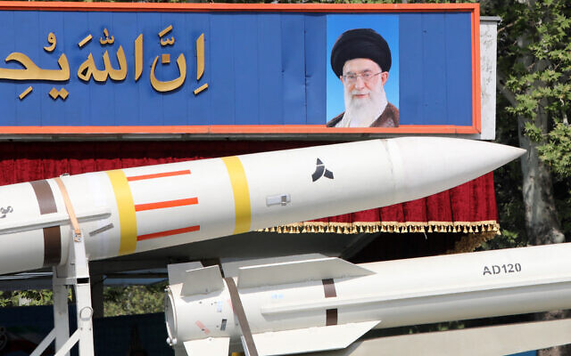 An Iranian military truck carries parts of a Sayad 4-B missile past a portrait of supreme leader Ayatollah Ali Khamenei during a military parade as part of a ceremony marking the country's annual army day in Tehran on April 17, 2024. (Atta Kenare / AFP)