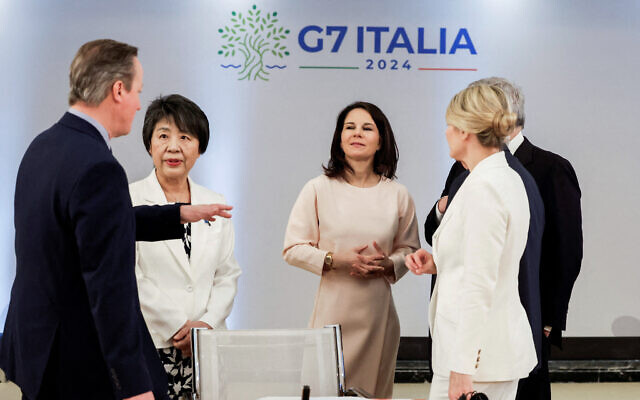 (From L) British Foreign Secretary David Cameron, Japanese Foreign Minister Yoko Kamikawa,  German Foreign Minister Annalena Baerbock and Canadian Minister of Foreign Affairs Melanie Joly speak during the G7 foreign ministers meeting on Capri island, on April 18, 2024. (Remo Casilli / POOL / AFP)