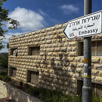 Illustrative: A road sign shows the way towards the US embassy in Jerusalem on April 19, 2024. (Ronaldo Schemidt/AFP)