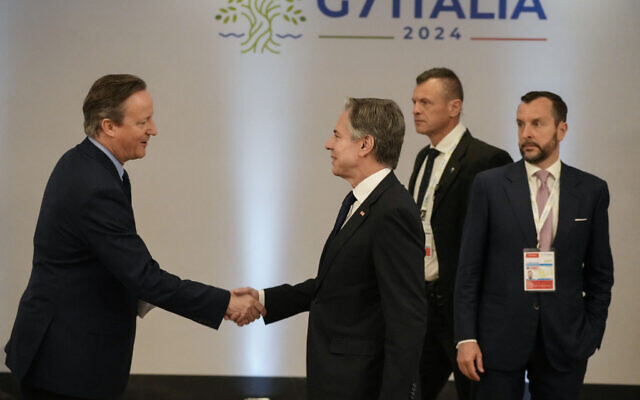 Britain's Foreign Secretary David Cameron (L) shakes hands with US Secretary of State Antony Blinken before a meeting on the sidelines of the G7 Foreign Ministers meeting on Capri Island, Italy, on April 19, 2024. (Gregorio Borgia/Pool/AFP)