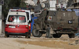 A Palestinian ambulance is seen in the West Bank on April 20, 2024. (Photo by Zain JAAFAR / AFP)