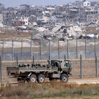This picture taken from Israel's southern border with the Gaza Strip shows an Israeli military vehicle along the border with the Palestinian enclave on April 24, 2024. (Jack Guez / AFP)