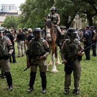 Texas State Troopers and other law enforcement personnel monitor the scene as pro-Palestinian students protest against Israel, on the campus of the University of Texas in Austin on April 24, 2024. (Suzanne Cordeiro/AFP)