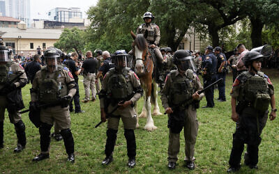 Texas State Troopers and other law enforcement personnel monitor the scene as pro-Palestinian students protest against Israel, on the campus of the University of Texas in Austin on April 24, 2024. (Suzanne Cordeiro/AFP)