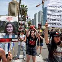 Israelis march during a protest by the relatives of hostages held in Gaza by Palestinian terrorists, outside Defense Ministry headquarters in Tel Aviv on April 25, 2024, to call for government action to release the hostages. (Jack Guez/AFP)
