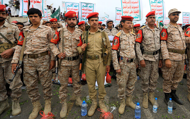 Yemeni security forces stand guard during a pro-Palestinian and anti-Israel rally in the Houthi-held capital Sanaa on April 26, 2024, amid the ongoing conflict in the Gaza Strip between Israel and the Palestinian terror group Hamas. (Photo by MOHAMMED HUWAIS / AFP)