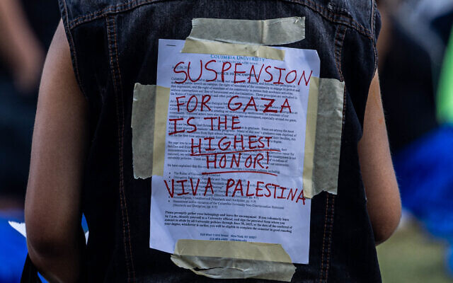 A US protester wears Columbia University's disciplinary notice covered over by support for Palestinians in Gaza at Columbia University on April 29, 2024 in New York City. (Alex Kent / GETTY IMAGES NORTH AMERICA / Getty Images via AFP)