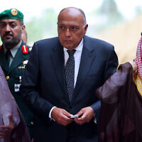 Saudi Foreign Minister Prince Faisal bin Farhan (R) and Egypt's Foreign Minister Sameh Shoukry (C) arrive to attend a meeting with their European counterparts held in Riyadh on April 29, 2024. (Fayez Nureldine / AFP)