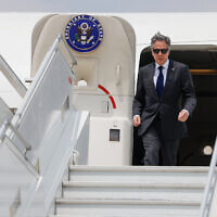 US Secretary of State Antony Blinken walks out of his plane upon his arrival at the airport in the Jordanian capital Amman on April 30, 2024. (Evelyn Hockstein / POOL / AFP)