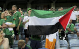 For illustration: An Ireland supporter holds a Palestinian flag on the stands during the Euro 2024 group B qualifying soccer match between Gibraltar and Ireland at the Argarve Stadium, outside Faro, Portugal, Oct. 16, 2023. (AP/Joao Matos)
