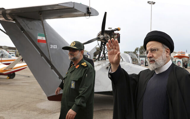 File: Iran's President Ebrahim Raisi (right) waves as he visits an exhibition of the Revolutionary Guard navy capabilities while accompanied by the guard's navy commander Alireza Tangsiri, in the southern port city of Bandar Abbas, Iran, February 2, 2024. (Iranian Presidency Office via AP)