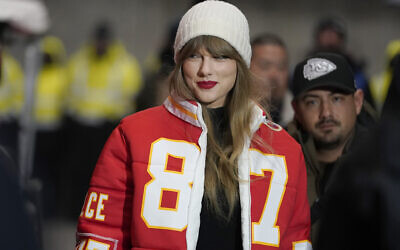FILE - Taylor Swift arrives at an NFL wild-card playoff football game between the Chiefs and the Miami Dolphins, Saturday, Jan. 13, 2024, in Kansas City, Missouri. (AP Photo/Ed Zurga, File)