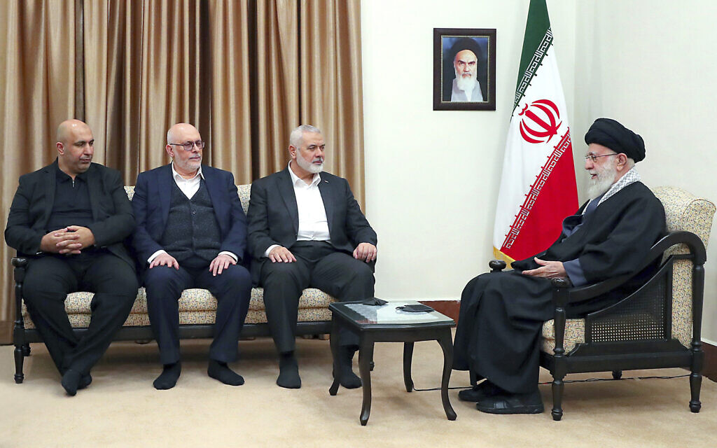 Illustrative: Iranian Supreme Leader Ayatollah Ali Khamenei, right, speaks in a meeting with Hamas chief Ismail Haniyeh, second right, and his delegation, in Tehran, Iran, March 26, 2024. (Office of the Iranian Supreme Leader via AP)