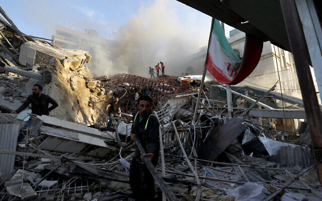 Emergency services work at an Iranian consular building after it was hit by an alleged Israeli strike in Damascus, Syria, April 1, 2024. (AP Photo/Omar Sanadiki)