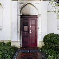 Traces of fire can be seen on a synagogue entrance door damaged by an incendiary device in Oldenburg, Germany, April 5, 2024. (Hauke-Christian Dittrich/dpa via AP)