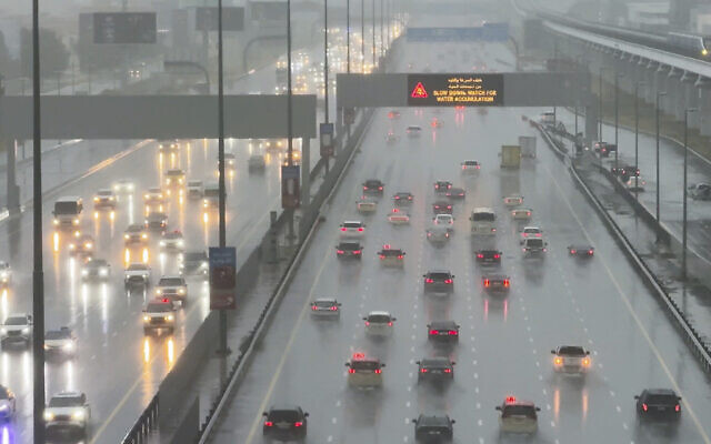 Vehicles drive through heavy rain on the Sheikh Zayed Road highway in Dubai, United Arab Emirates, April 16, 2024. (Jon Gambrell/AP)