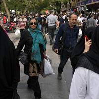 Illustrative: People walk around the old main bazaar in Tehran, Iran, Tuesday, April 16, 2024. (AP Photo/Vahid Salemi)
