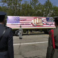 An anti-US banner is carried on a truck during Army Day parade at a military base in northern Tehran, Iran, April 17, 2024. (AP/Vahid Salemi)