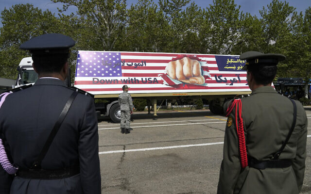 An anti-US banner is carried on a truck during Army Day parade at a military base in northern Tehran, Iran, April 17, 2024. (AP/Vahid Salemi)