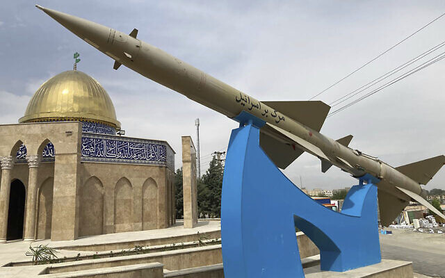Illustrative: A missile is on display with a sign on it which reads 'Death to Israel' in Farsi, in front of a mosque in the shape of Jerusalem's Dome of the Rock, at an entrance to Quds, an Iranian town to the west of the capital Tehran, April 21, 2024. (AP Photo/Vahid Salemi)