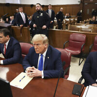 Former US President Donald Trump, center, awaits the start of proceedings at Manhattan criminal court in New York on April 22, 2024. (AP/Yuki Iwamura, Pool)