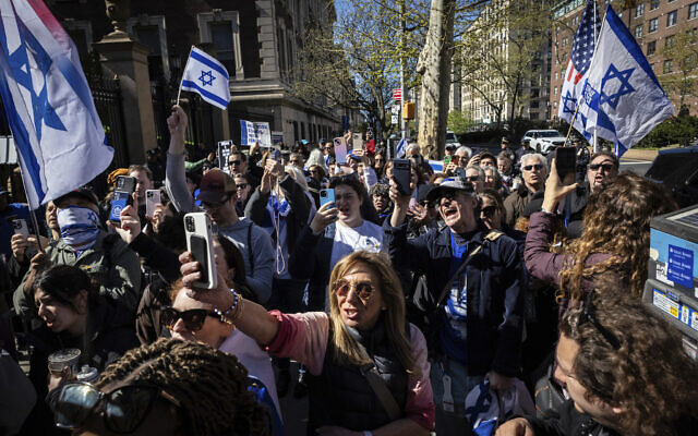 Pro-Israel demonstrators chant "Shame" in support of Columbia University assistant professor Shai Davidai, who was denied access to the main campus to prevent him from accessing the lawn currently occupied by pro-Palestine student demonstrators in New York on Monday, April 22, 2024.  (AP Photo/Stefan Jeremiah)
