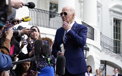 US President Joe Biden talks with reporters on the South Lawn of the White House in Washington, April 25, 2024, before departing on a trip to New York. (AP Photo/Susan Walsh)