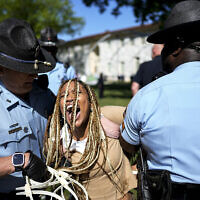 Georgia State Patrol officers detain a demonstrator on the campus of Emory University during a pro-Palestinian demonstration, April 25, 2024, in Atlanta. (AP Photo/Mike Stewart)