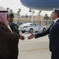 US Secretary of State Antony Blinken is welcomed by Saudi Foreign Ministry Director of Protocol Affairs Mohammed Al-Ghamdi as he arrives in Riyadh, Saudi Arabia, Monday, April 29, 2024. (Evelyn Hockstein/Pool Photo via AP)