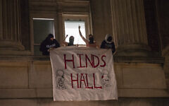 File: Anti-Israel demonstrators at Columbia University Campus unfurl a banner as they barricade themselves inside Hamilton Hall, naming it after Hind Rajab, a Palestinian Gazan six-year-old girl killed in an Israeli airstrike amid Israel's war on Hamas, April 30, 2024, in New York City. (Marco Postigo Storel via AP)