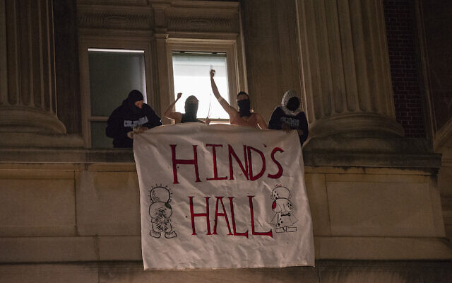 File: Anti-Israel demonstrators at Columbia University Campus unfurl a banner as they barricade themselves inside Hamilton Hall, naming it after Hind Rajab, a Palestinian Gazan six-year-old girl killed in an Israeli airstrike amid Israel's war on Hamas, April 30, 2024, in New York City. (Marco Postigo Storel via AP)