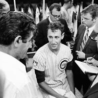 Chicago Cubs pitcher Ken Holtzman talks with reporters after a match against Atlanta in Chicago on August 19, 1969. (James Palmer/AP Photo)