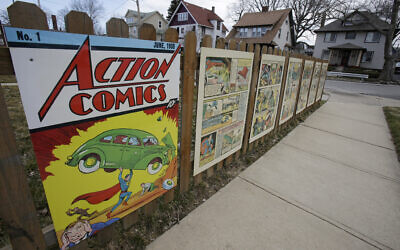 Oversized Superman comic book pages displayed on a fence outside of what was once artist Joe Shuster's boyhood home in Cleveland, Ohio in 2013. (AP/Tony Dejak, File)