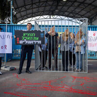 Likud MK Boaz Bismuth and activists protest against United Nations Relief and Works Agency for Palestine Refugees (UNRWA) outside their offices in Jerusalem, April 9, 2024. (Yonatan Sindel/Flash90)
