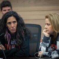 Released hostage Raz Ben Ami (right) and Reuma Tarshansky attend status of Women and Gender Equality committee meeting at the Knesset in Jerusalem on Tuesday.  (Yonatan Sindel/Flash90)