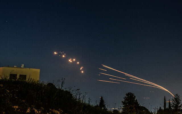 The Iron Dome air defense system intercepts rockets fired from Lebanon, as seen over the Hula Valley, April 12, 2024 (Ayal Margolin/Flash90)