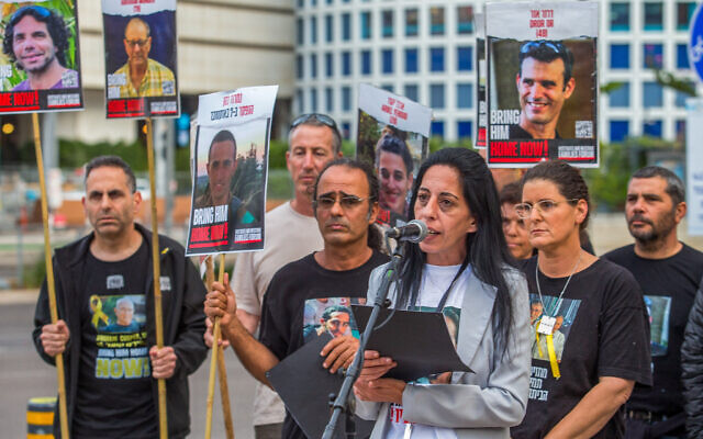 Einav Zangauker (at the microphone) and relatives of several other Israelis held hostage in Gaza denounce Prime Minister Benjamin Netanyahu for allegedly sabotaging a potential deal for their release, at a protest on Begin Street in Tel Aviv on April 13, 2024. (Flash90)