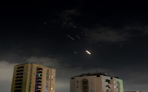 Interceptor missiles are fired at Iranian drones and missiles launched at Israel, as seen over Tel Aviv on April 14, 2024. (Tomer Neuberg/Flash90)