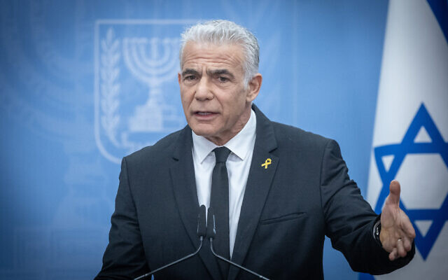 Opposition and Yesh Atid party leader Yair Lapid, leads a faction meeting at the Knesset, in Jerusalem, on April 15, 2024. (Chaim Goldberg/Flash90)