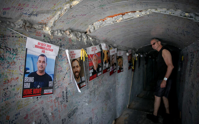 People visit a tunnel installation at Hostages Square in Tel Aviv on April 16, 2024. (Miriam Alster/Flash90)
