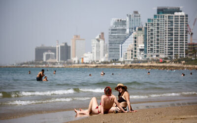 Enjoying the beach in Tel Aviv, during a heatwave, on April 24, 2024. (Dor Pazuelo/Flash90)