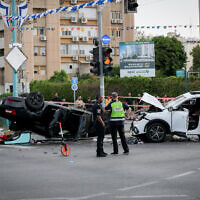 The car (left) of National Security Minister Itamar Ben Gvir that was in an accident in Ramle. April 26, 2024. (Jamal Awad/Flash90)