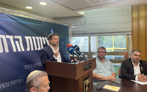 Finance Minister Bezalel Smotrich addresses the media following a meeting of his Religious Zionism faction in the Knesset, April 30, 2024. (Sam Sokol/Times of Israel)