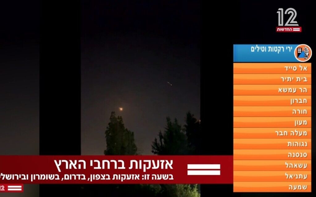 A TV report shows missile alerts across Israel, as Iran fires ballistic missiles and the IDF moves to intercept them, shortly before 2 a.m. on April 14, 2024 (Channel 12 screenshot)
