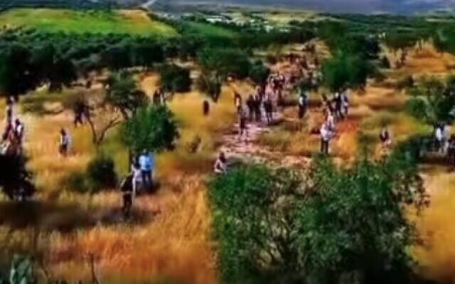 Settlers attack the Palestinian village of al-Mughayyir in the West Bank on April 13, 2024. (Screen capture/X)