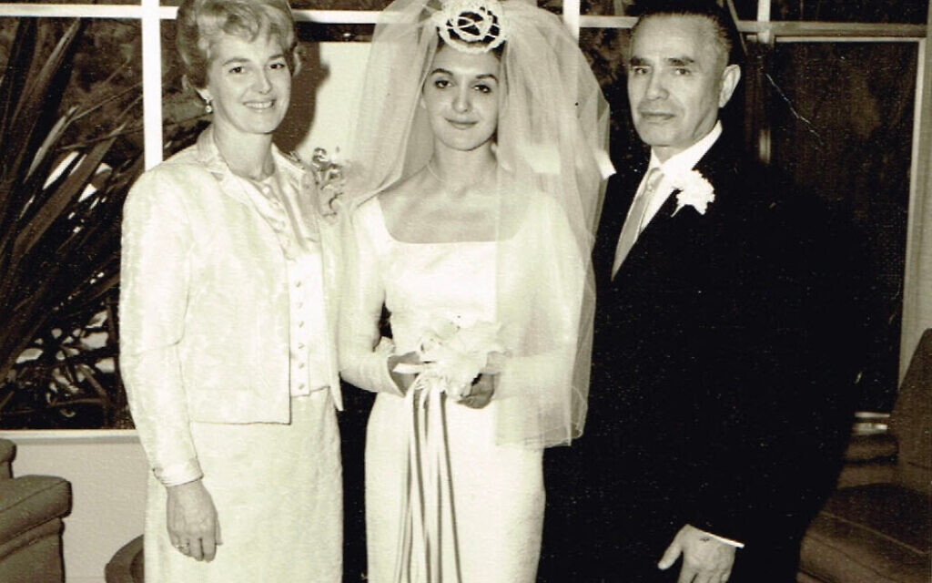 Elida on her wedding day with her adoptive parents Toibe and Lazar Goldberg, Los Angeles, 1963. (Courtesy of Zipora Klein Jakob)