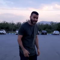 File: Iranian rapper Toomaj Salehi in the music video for his protest song 'Mouse Hole,' uploaded to Youtube on July 28, 2021. (Screen capture: Youtube/Toomaj Salehi, used in accordance with Clause 27a of the Copyright Law)