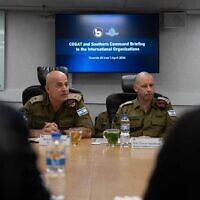 Chief of the IDF Southern Command, Maj. Gen. Yaron Finkelman (right), and the head of COGAT, Maj. Gen. Ghassan Alian, meet with representatives of humanitarian aid organizations at the Southern Command HQ in Beersheba, April 10, 2024. (Israel Defense Forces)